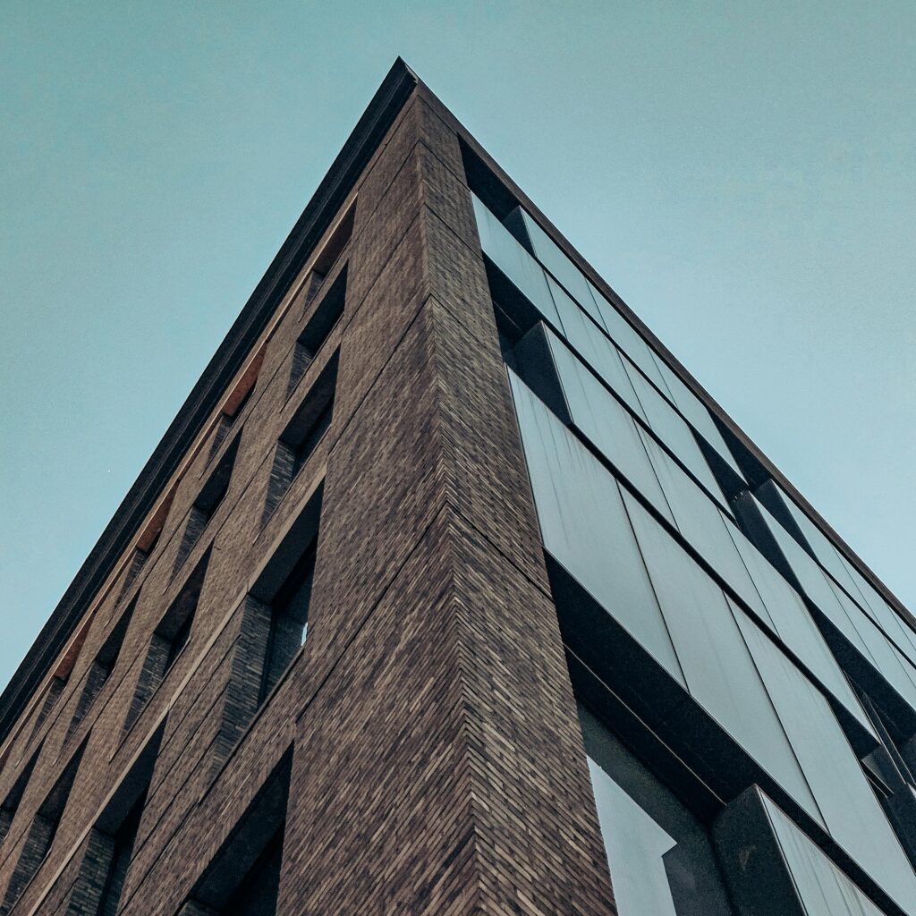 Dramatic perspective of a tall building showcasing modern New York architecture.